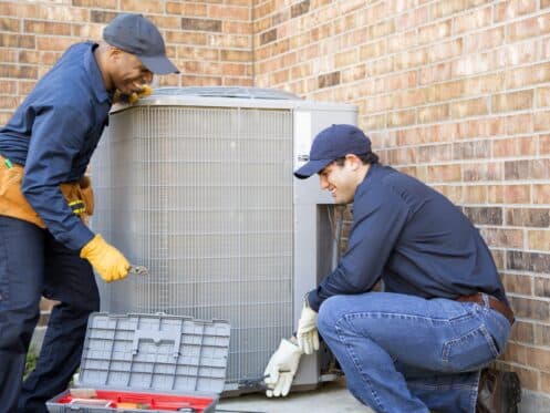 HVAC Technicians Performing AC Maintenance to Improve Indoor Air Quality in Cobourg, ON